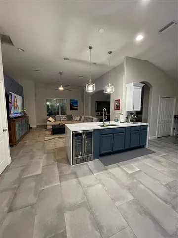 a view of kitchen with microwave and cabinets