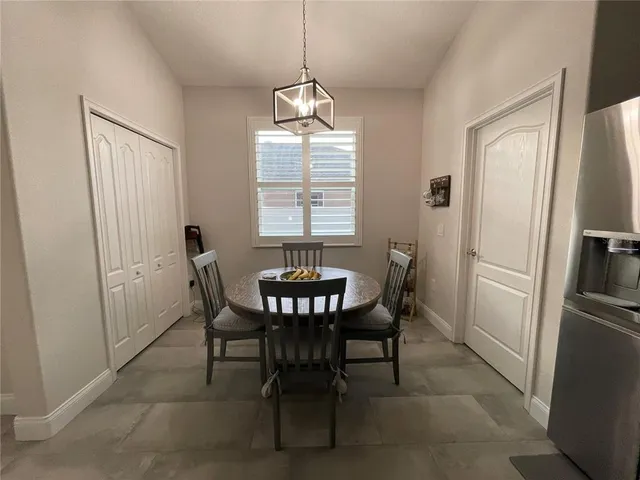 a view of a dining room with furniture window and outside view