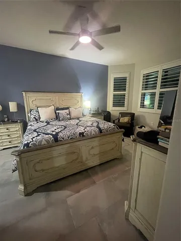 a bedroom with bed furniture and window