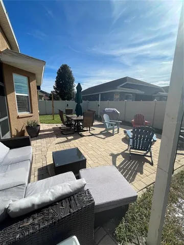 a view of swimming pool with seating space