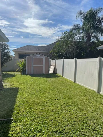 a view of a back yard of the house