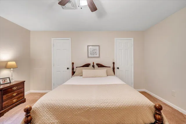 a view of a house with car parked in front of house