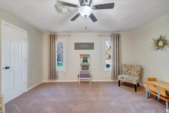 a view of a swimming pool with a yard