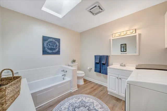 an aerial view of mountain with residential house and ocean view