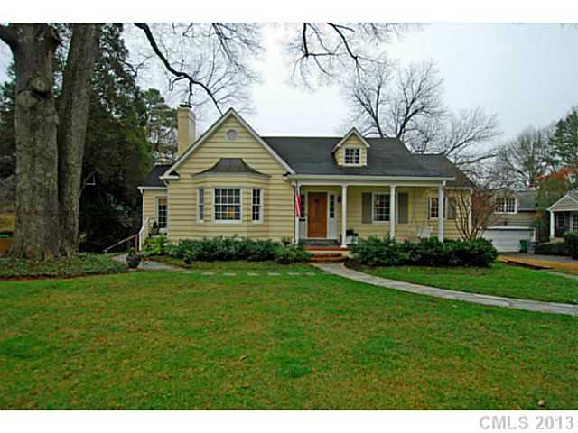 1943 Harris Road Charlotte, NC 28211 - Photo 1 of 16 a front view of a house with a garden