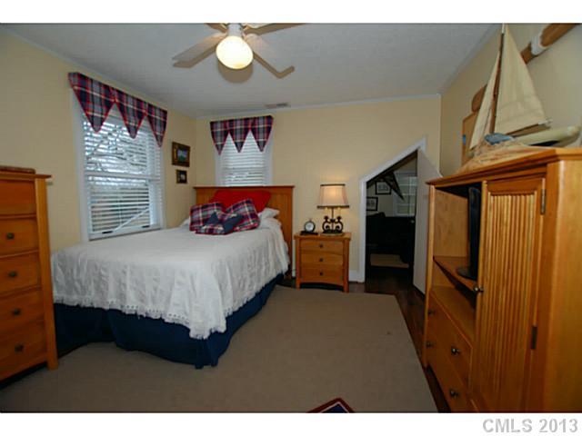 1943 Harris Road Charlotte, NC 28211 - Photo 13 of 16 a bedroom with a bed closet and a window