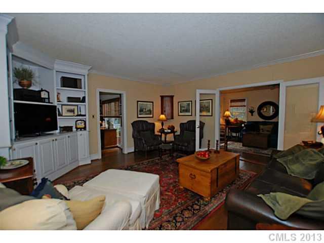 1943 Harris Road Charlotte, NC 28211 - Photo 7 of 16 a living room with furniture and a flat screen tv