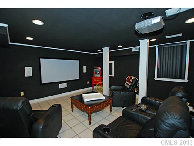 1943 Harris Road Charlotte, NC 28211 - Photo 9 of 16 a living room with furniture and a flat screen tv