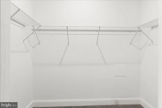 a view of a room with racks on the wall