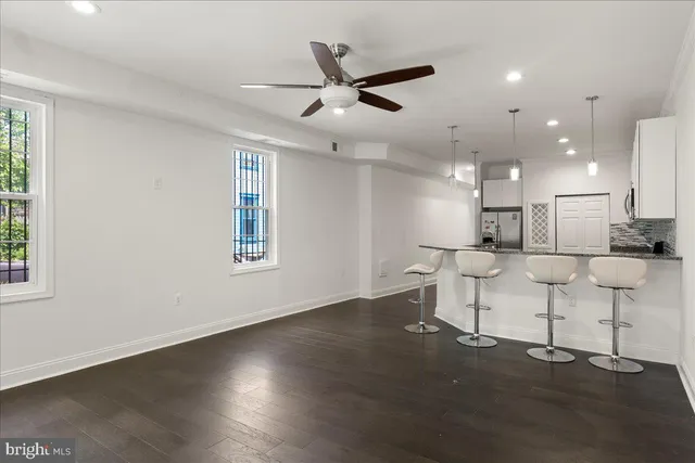 an open kitchen with table and chairs