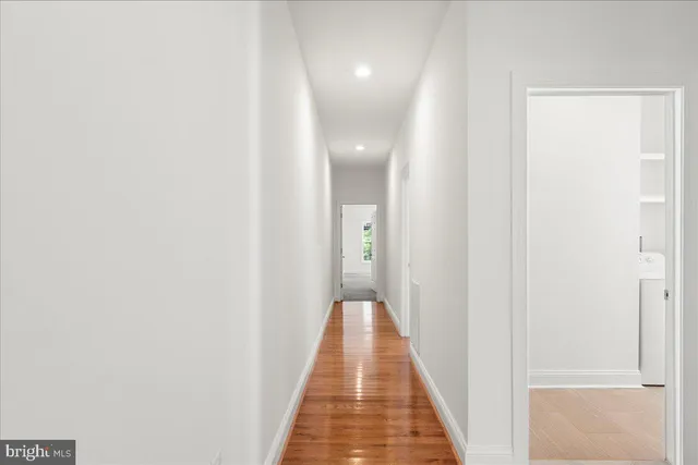 a view of a hallway with a white door