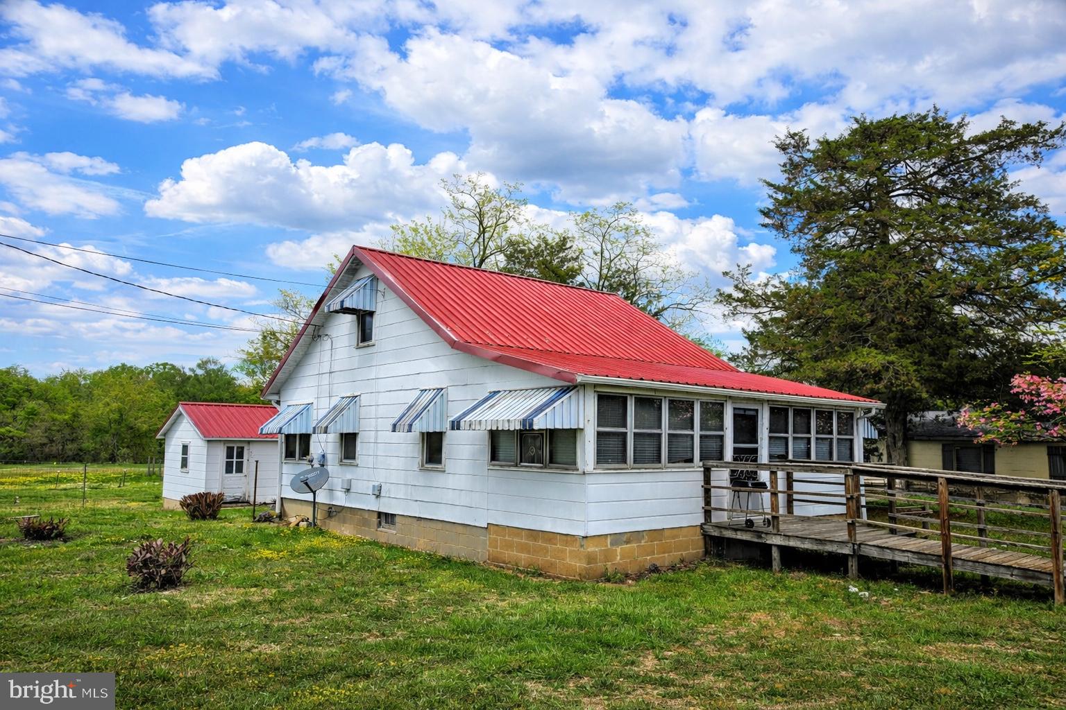 210 Groff Road Millington, MD 21651 - Photo 2 of 14 Charming home with vibrant red roof.