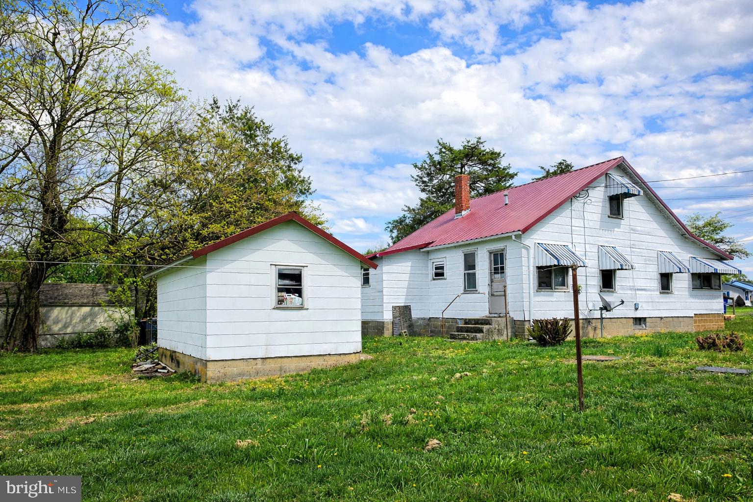 210 Groff Road Millington, MD 21651 - Photo 3 of 14 Charming home with vibrant red roof.