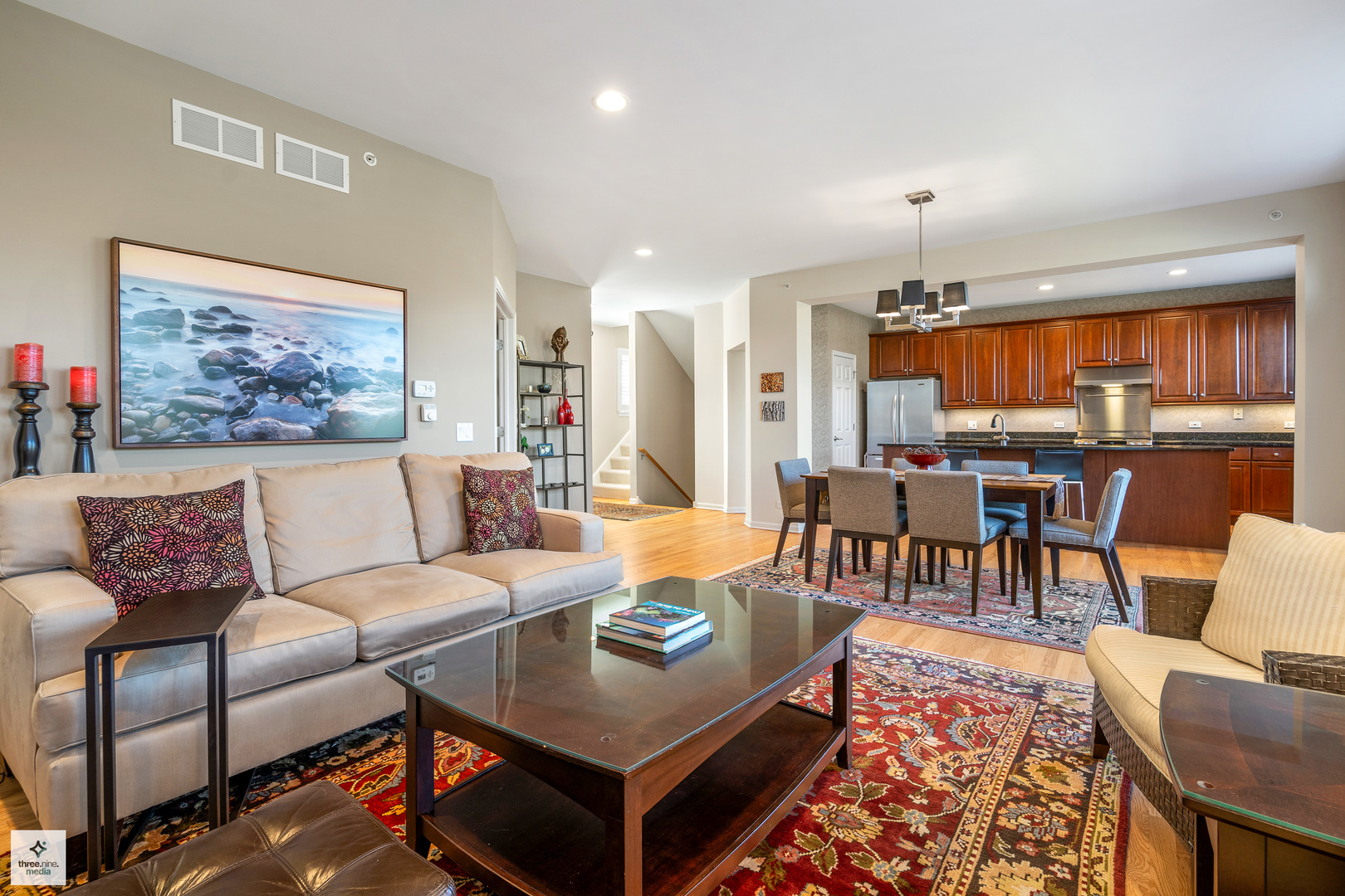 705 Lyster Road Highwood, IL 60040 - Photo 6 of 24 a living room with furniture a chandelier and a dining table