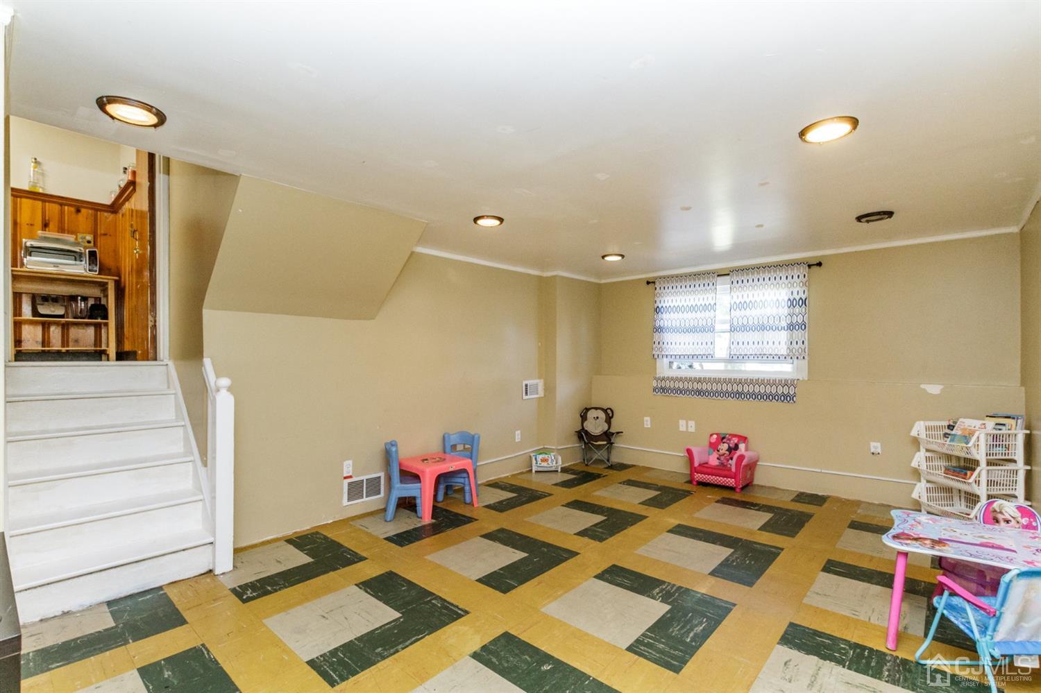 709 Exeter Road Linden, NJ 07036 - Photo 23 of 28 a bed room with a bed and a window