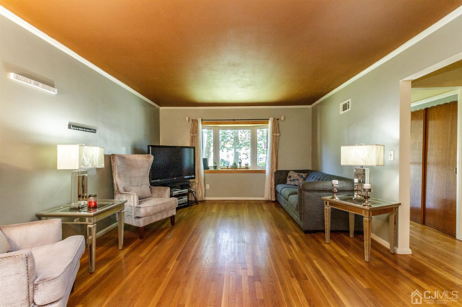 709 Exeter Road Linden, NJ 07036 - Photo 5 of 28 a living room with furniture and a flat screen tv