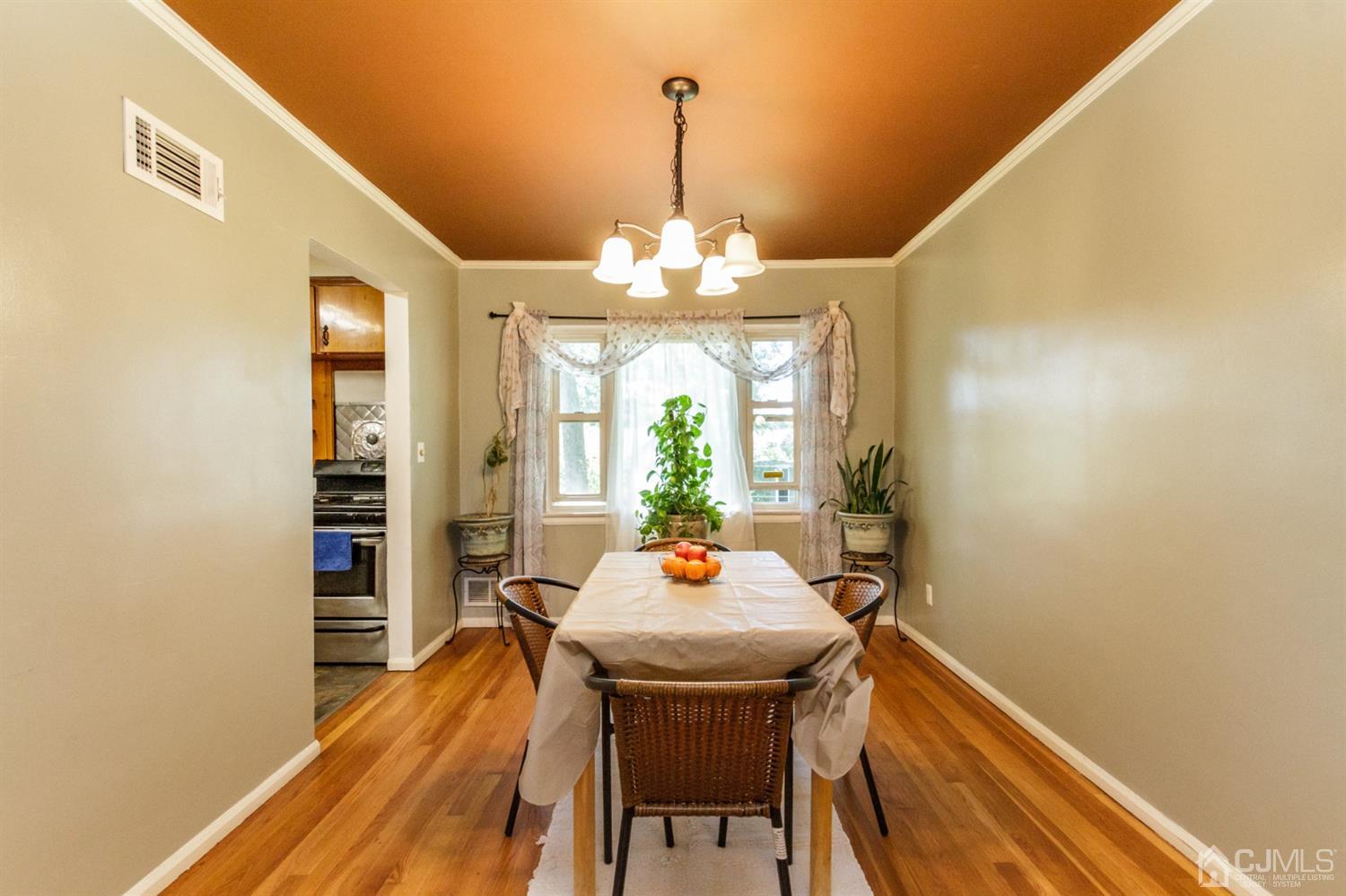 709 Exeter Road Linden, NJ 07036 - Photo 7 of 28 a view of a dining room with furniture window and wooden floor