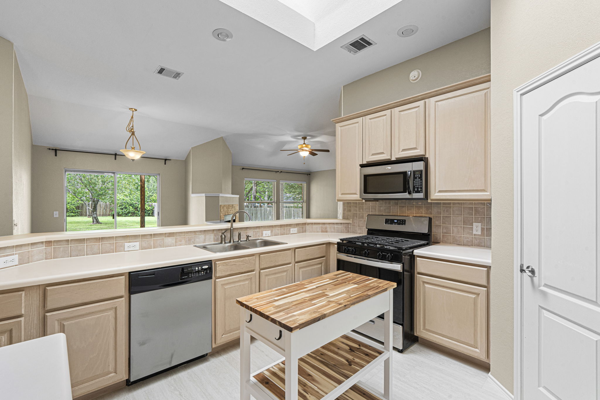 7172 Ridge Oak Road Austin, TX 78749 - Photo 19 of 40 A well-lit kitchen with modern appliances and an open-concept design for seamless entertaining.