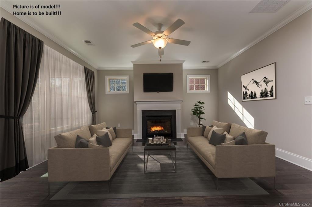 2061 New Style Way, Unit 30 Tega Cay, SC 29708 - Photo 2 of 40 a living room with furniture and a fireplace