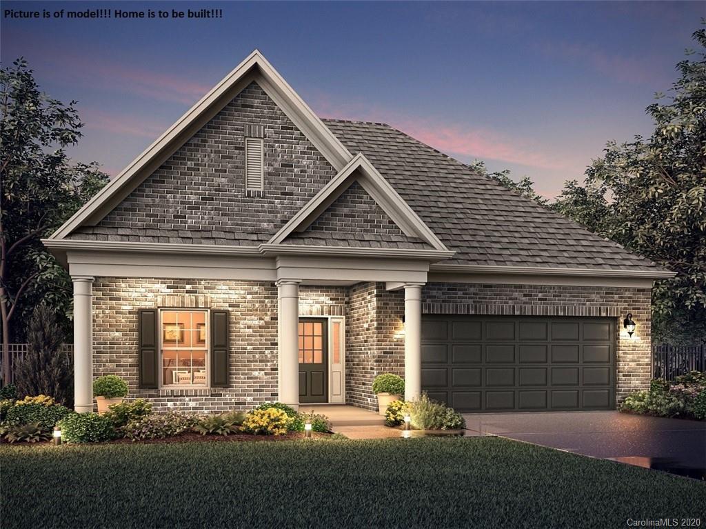 2061 New Style Way, Unit 30 Tega Cay, SC 29708 - Photo 15 of 40 a front view of a house with a yard