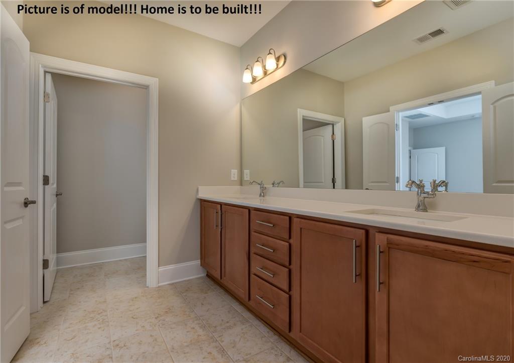 2061 New Style Way, Unit 30 Tega Cay, SC 29708 - Photo 31 of 40 a spacious bathroom with a double vanity sink and a mirror