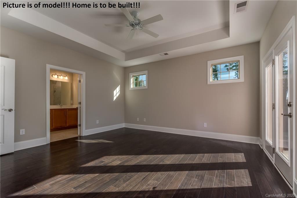 2061 New Style Way, Unit 30 Tega Cay, SC 29708 - Photo 32 of 40 wooden floor in an empty room with a window