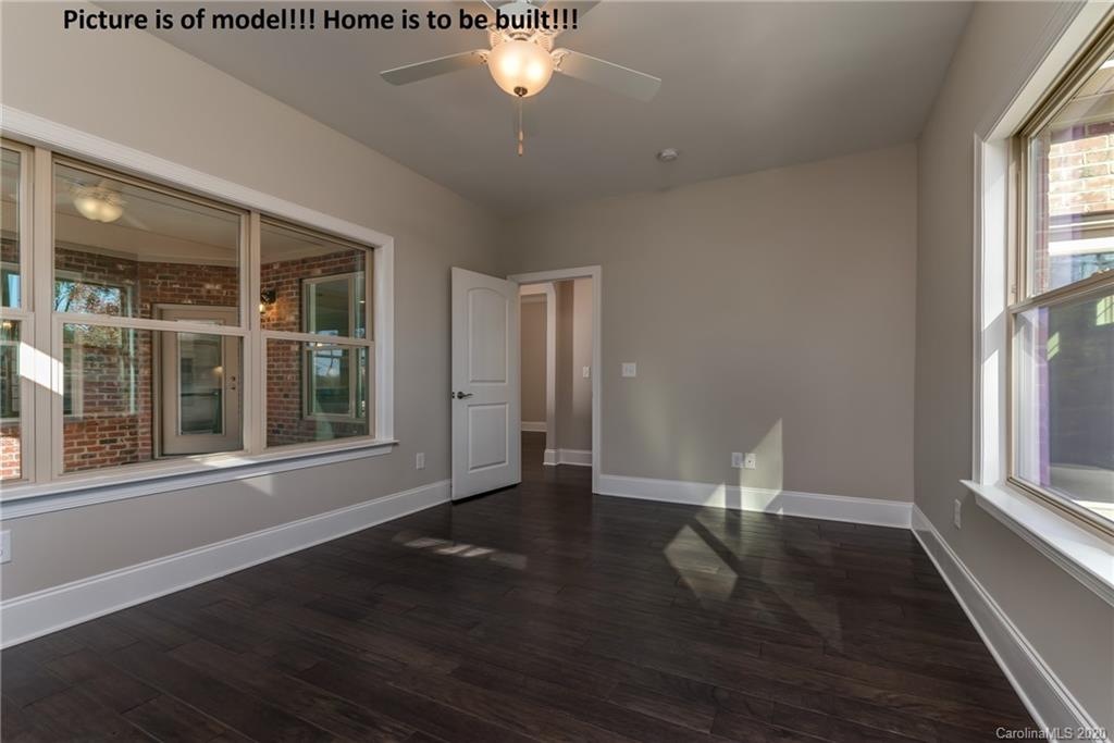 2061 New Style Way, Unit 30 Tega Cay, SC 29708 - Photo 39 of 40 a view of empty room with wooden floor and fan