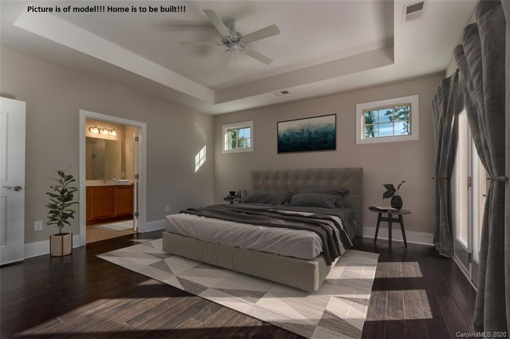 2061 New Style Way, Unit 30 Tega Cay, SC 29708 - Photo 5 of 40 a bedroom with a bed and a television