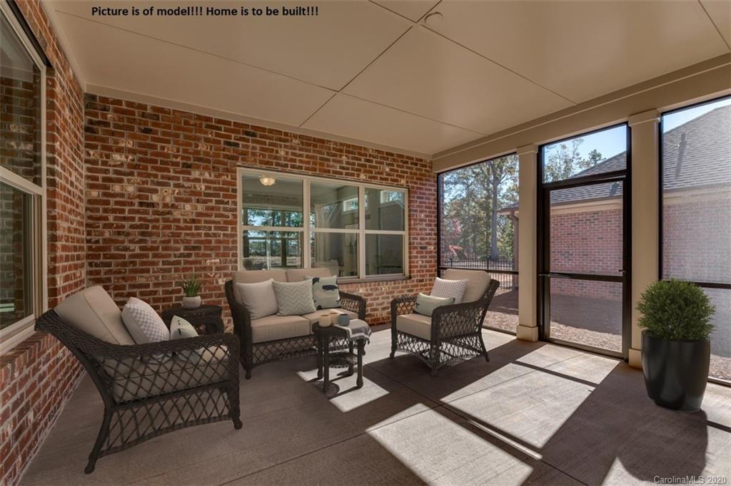 2061 New Style Way, Unit 30 Tega Cay, SC 29708 - Photo 6 of 40 a living room with furniture and a floor to ceiling window