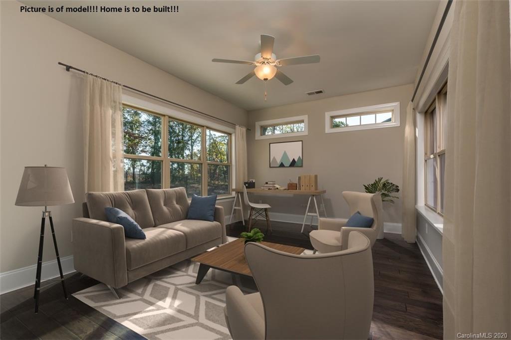2061 New Style Way, Unit 30 Tega Cay, SC 29708 - Photo 8 of 40 a living room with furniture and a large window