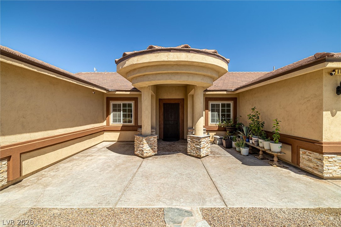 6720 Stubblefield Drive Pahrump, NV 89061 - Photo 4 of 51 An inviting entrance with a unique circular portico welcomes you home.