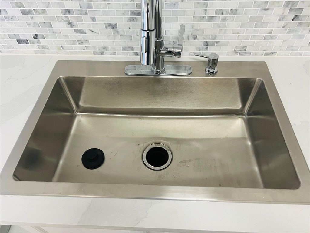 2668 Bering Drive, Unit 2668 Houston, TX 77057 - Photo 16 of 47 a close view of sink and stove