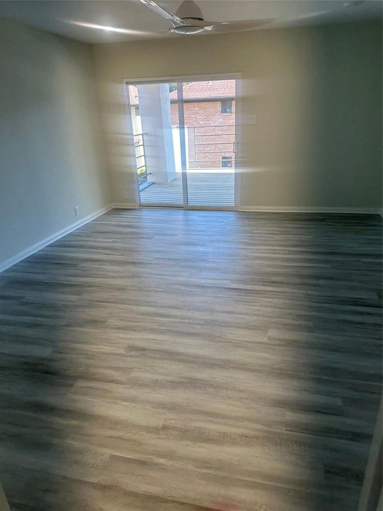2668 Bering Drive, Unit 2668 Houston, TX 77057 - Photo 38 of 47 a view of empty room with wooden floor and fan
