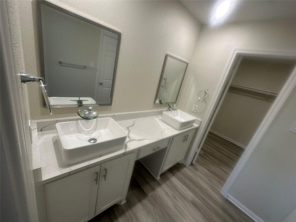 2668 Bering Drive, Unit 2668 Houston, TX 77057 - Photo 40 of 47 a bathroom with a sink and a mirror