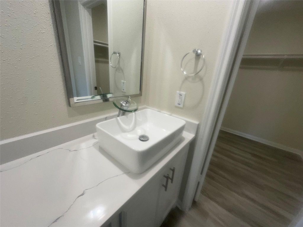 2668 Bering Drive, Unit 2668 Houston, TX 77057 - Photo 41 of 47 a bathroom with a sink and a mirror