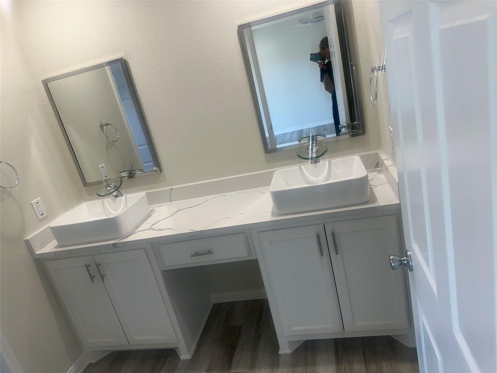 2668 Bering Drive, Unit 2668 Houston, TX 77057 - Photo 42 of 47 a bathroom with a sink and a mirror