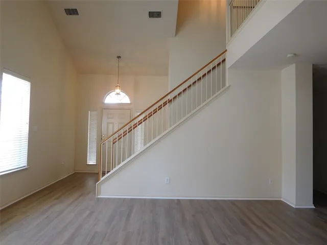 a view of entryway with wooden floor