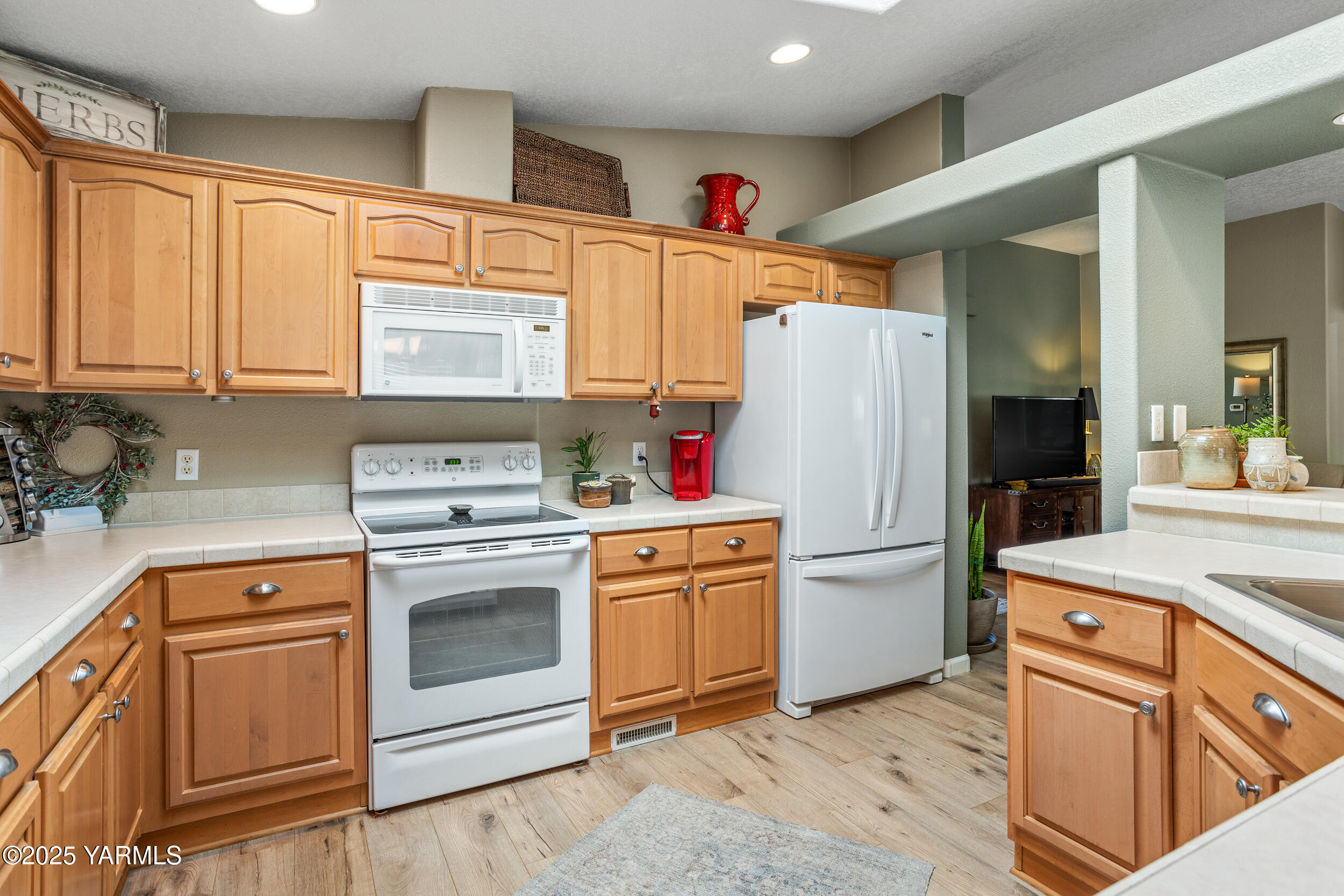 200 Bridle Way, Unit 203 Yakima, WA 98901 - Photo 11 of 36 a kitchen with a white cabinets and white appliances