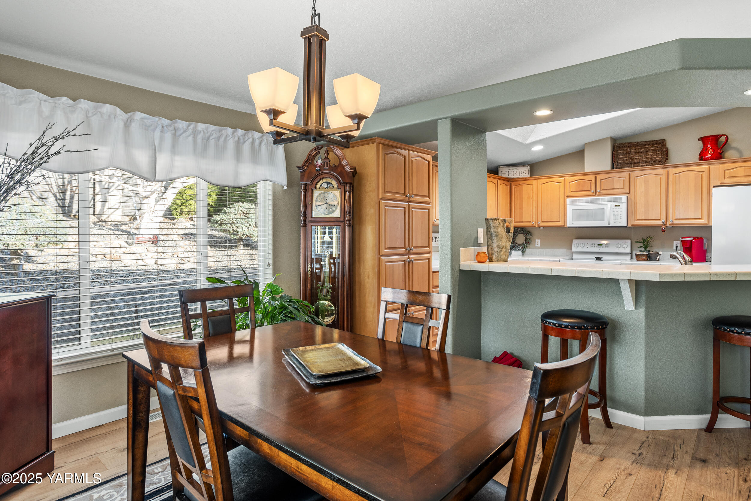 200 Bridle Way, Unit 203 Yakima, WA 98901 - Photo 12 of 36 a view of a dining room with furniture window and wooden floor