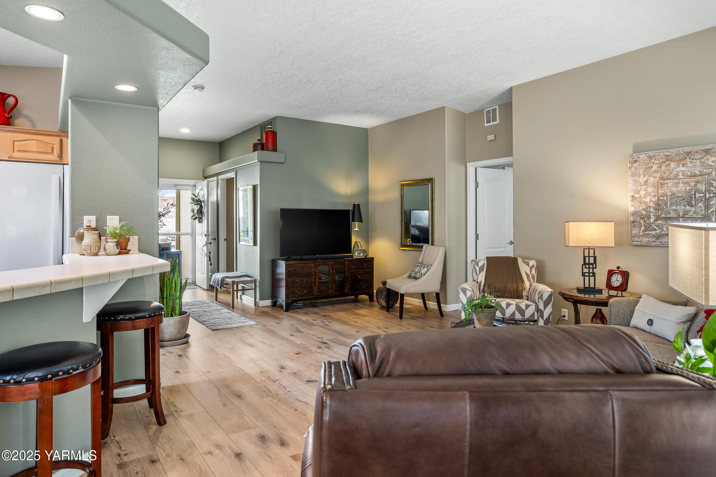 200 Bridle Way, Unit 203 Yakima, WA 98901 - Photo 13 of 36 a living room with furniture and a flat screen tv