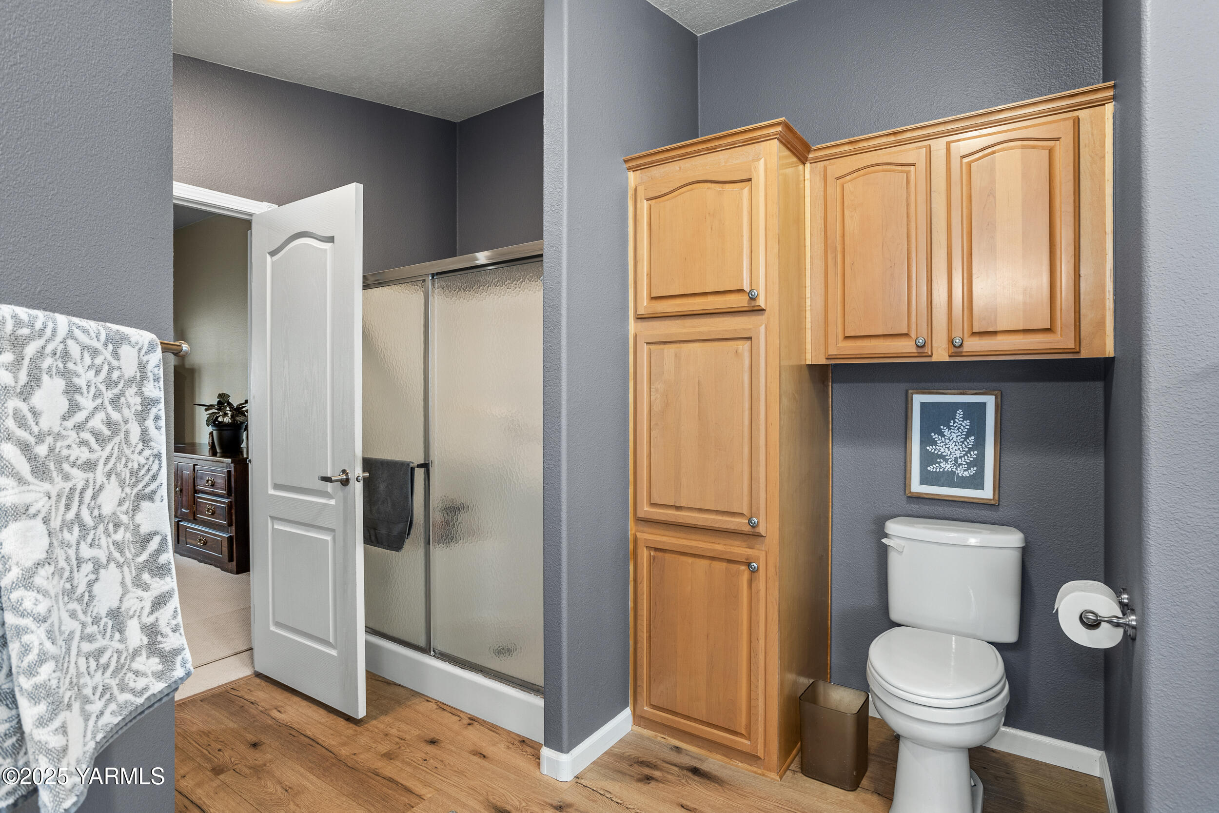 200 Bridle Way, Unit 203 Yakima, WA 98901 - Photo 18 of 36 a bathroom with a granite countertop toilet and a sink