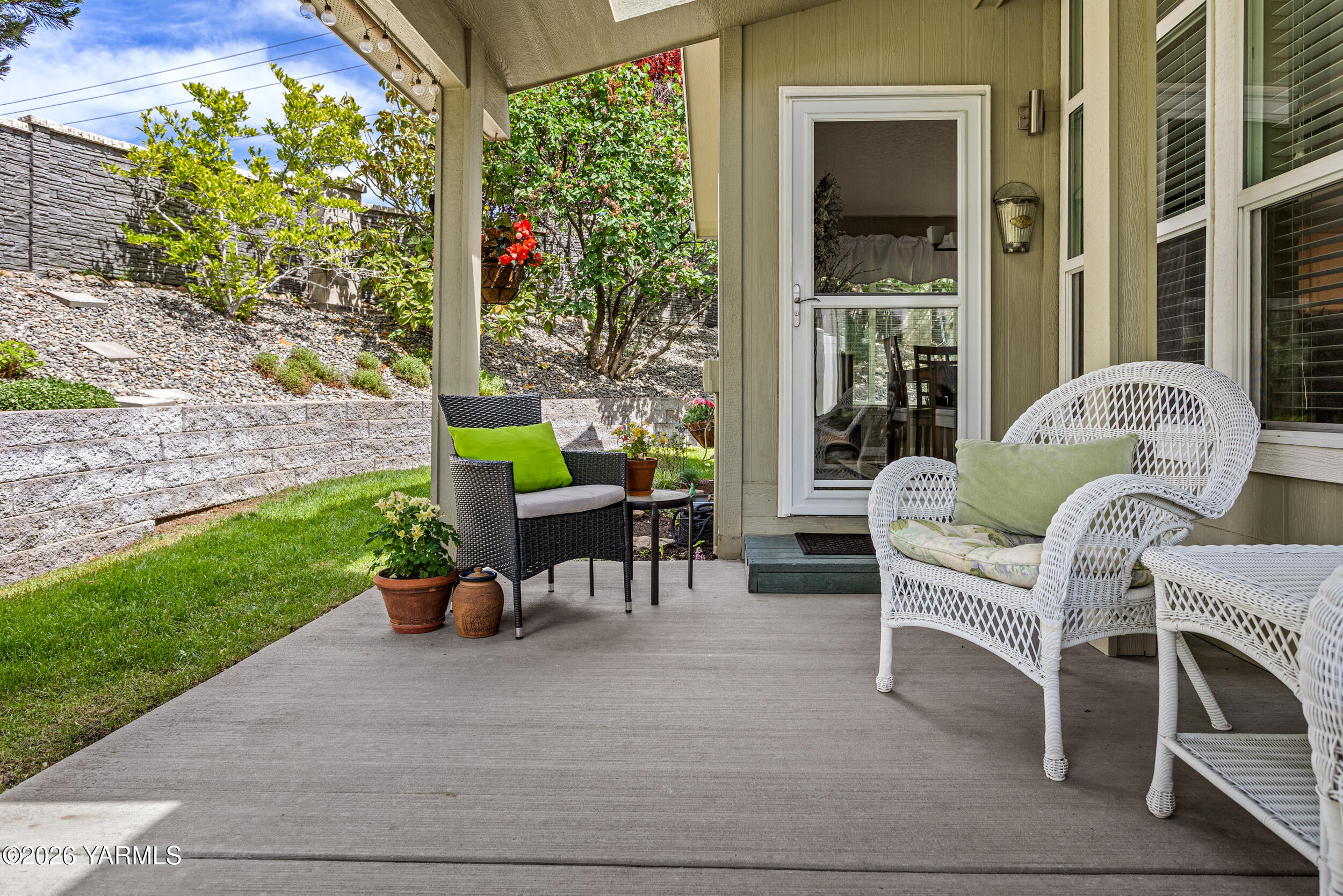 200 Bridle Way, Unit 203 Yakima, WA 98901 - Photo 28 of 36 a view of a patio with a table and chairs in patio