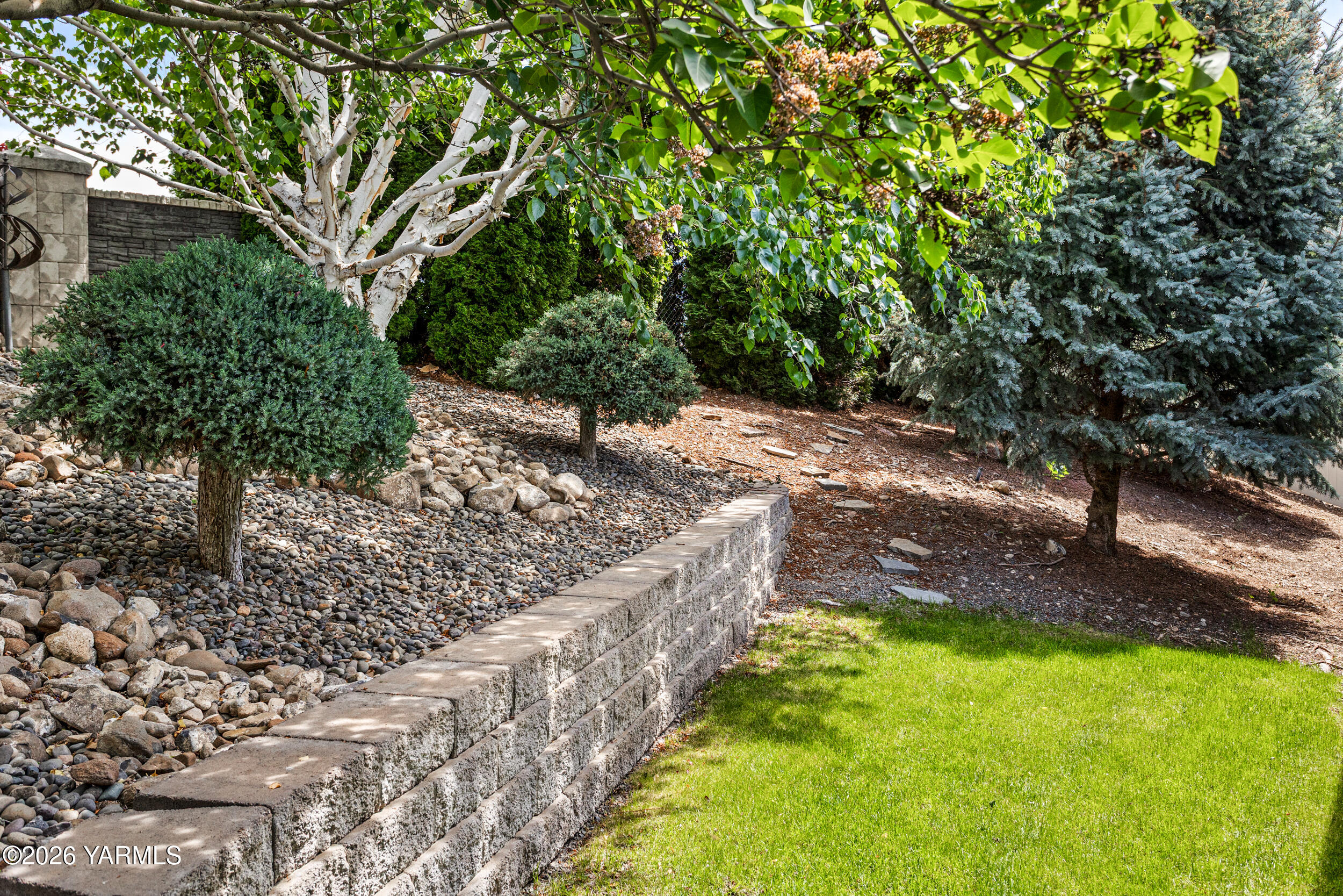 200 Bridle Way, Unit 203 Yakima, WA 98901 - Photo 29 of 36 a view of a yard with large trees
