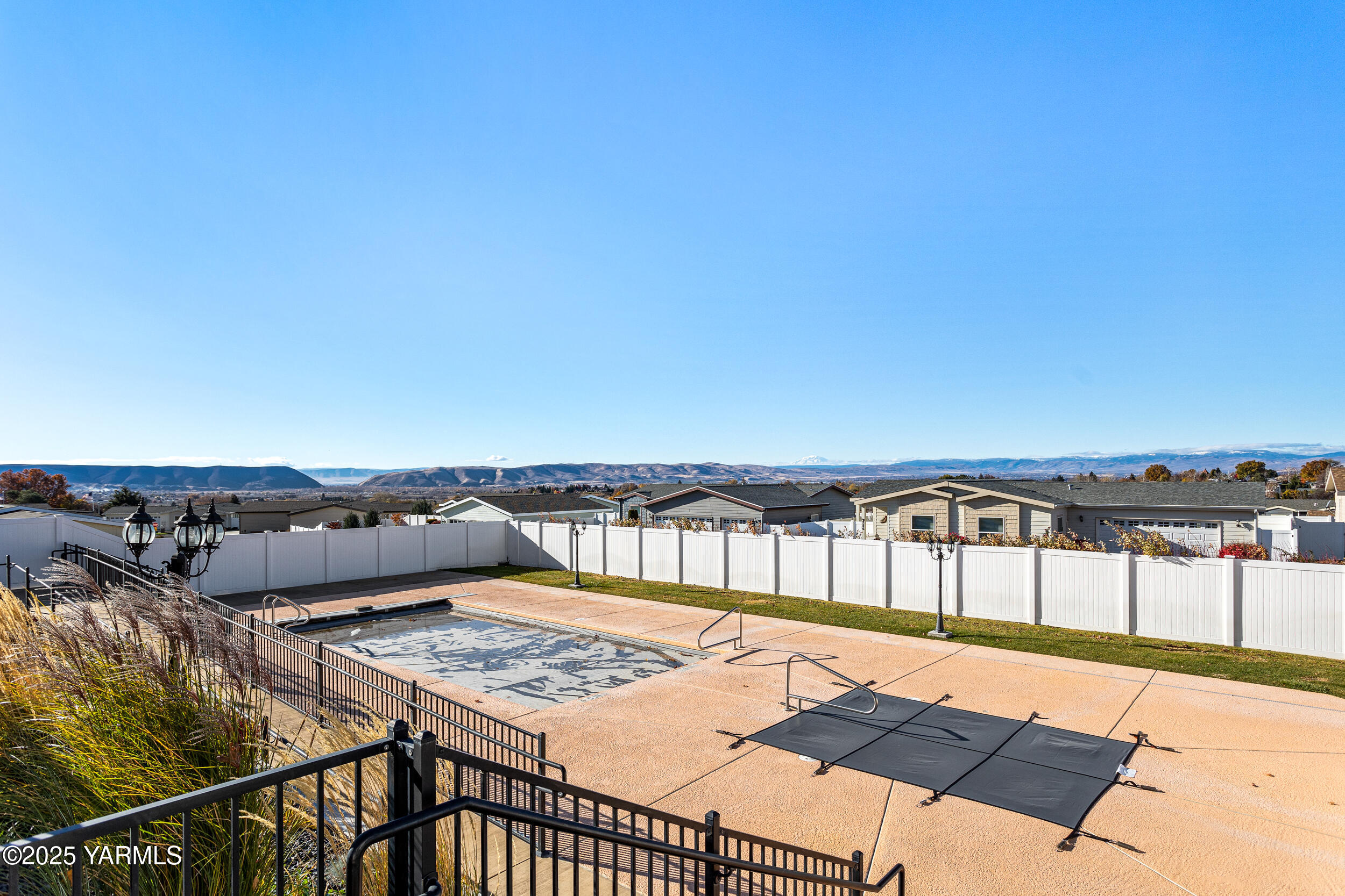 200 Bridle Way, Unit 203 Yakima, WA 98901 - Photo 35 of 36 a view of a swimming pool with a lounge chairs