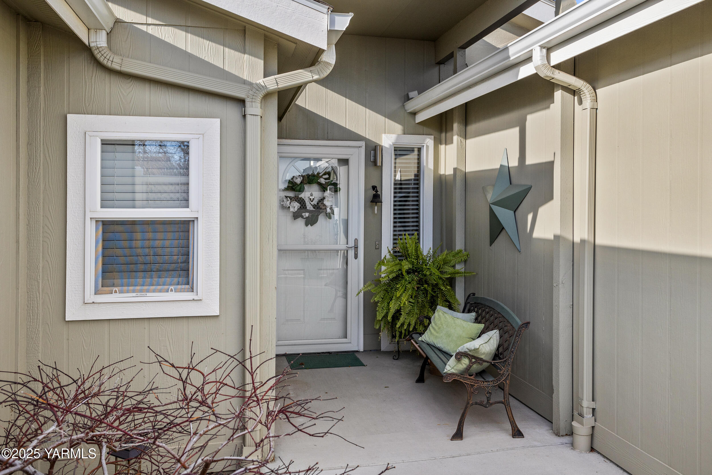 200 Bridle Way, Unit 203 Yakima, WA 98901 - Photo 4 of 36 a view of a porch with chairs and potted plants