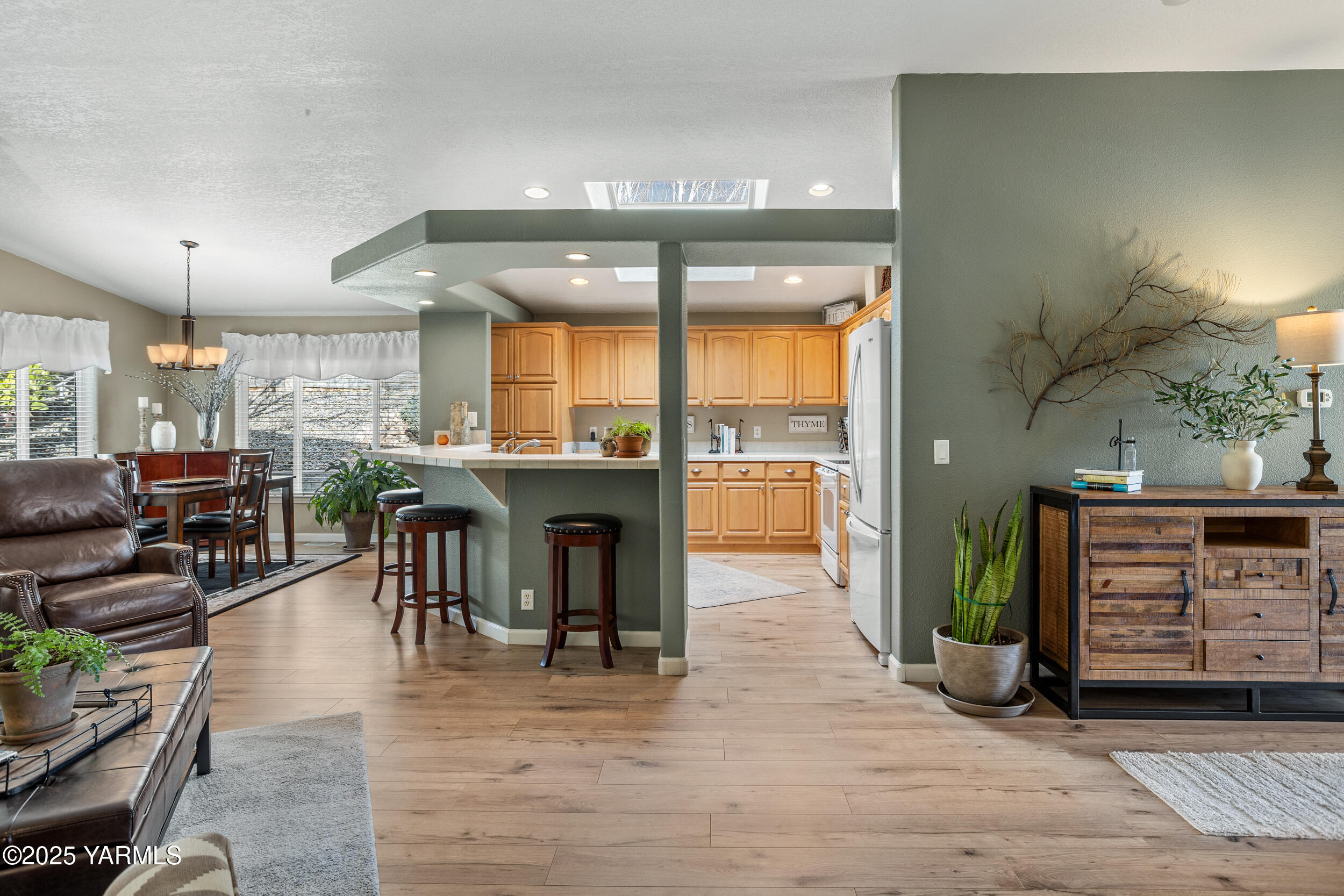 200 Bridle Way, Unit 203 Yakima, WA 98901 - Photo 8 of 36 a view of a dining room with furniture and wooden floor