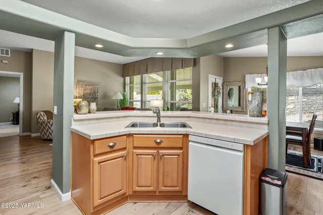 a open kitchen with stainless steel appliances granite countertop a sink and cabinets