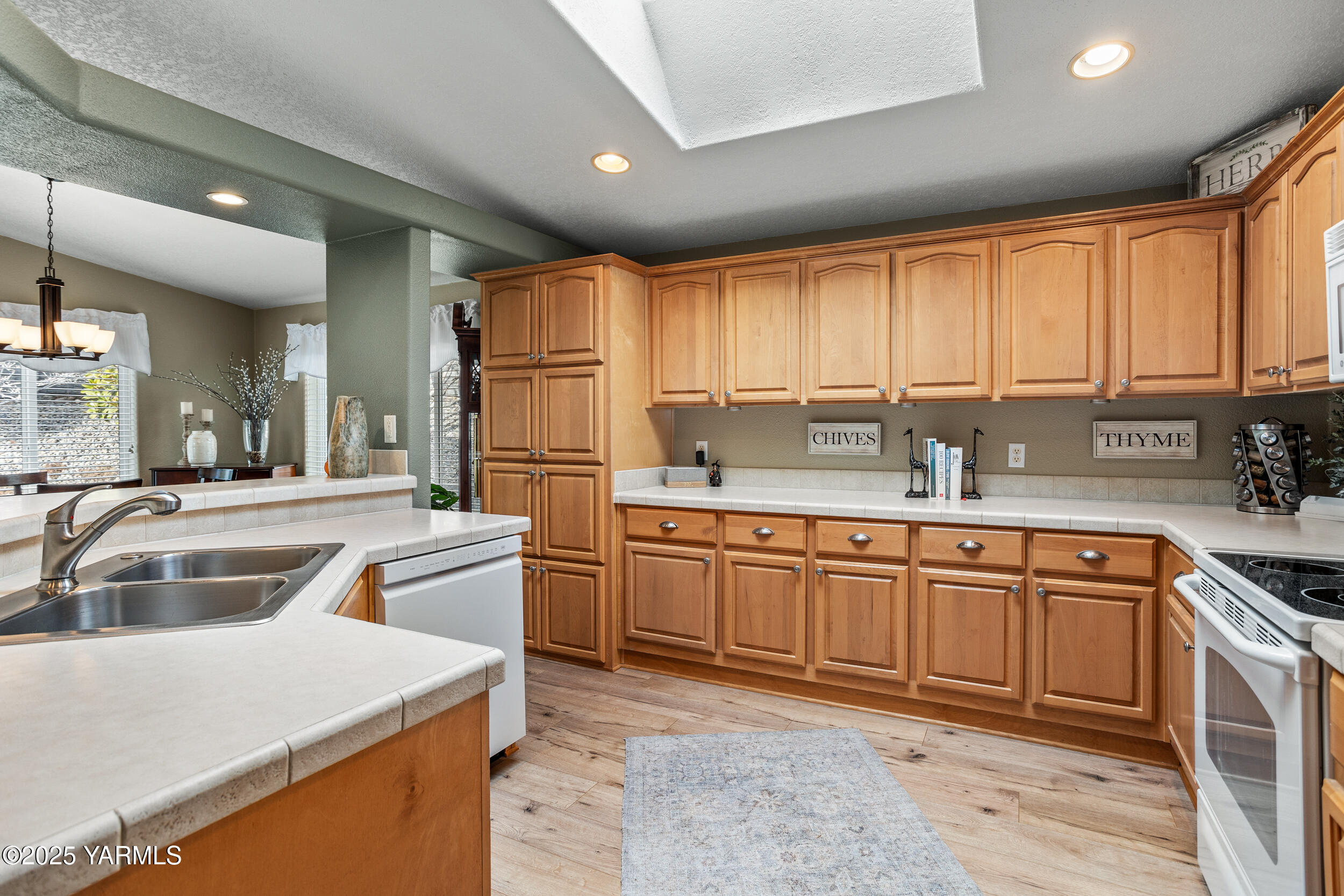 200 Bridle Way, Unit 203 Yakima, WA 98901 - Photo 9 of 36 a kitchen with stainless steel appliances granite countertop a sink stove and refrigerator