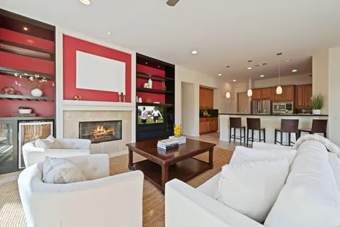 a living room with furniture and a fireplace