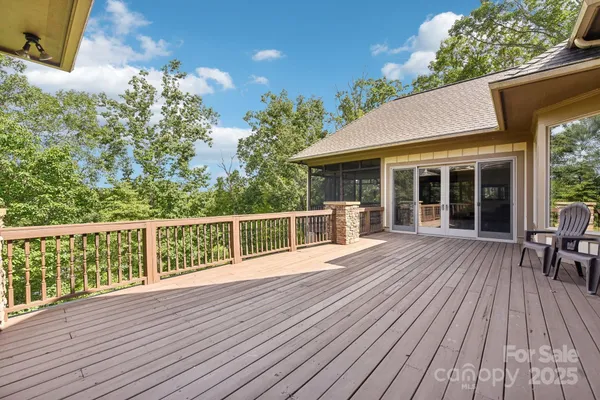 a view of a house with wooden deck